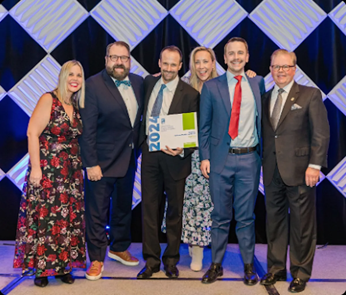 The Fruition and DEN team accepting the 2024 ACI Award for Best Website